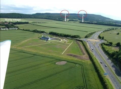 planning application to build two 140m high wind turbines beneath its